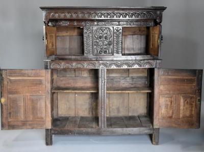 Wonderful mid 17thc carved oak press cupboard with superb patina