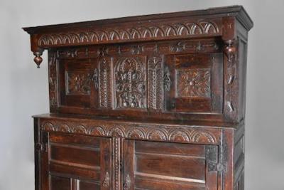 Wonderful mid 17thc carved oak press cupboard with superb patina