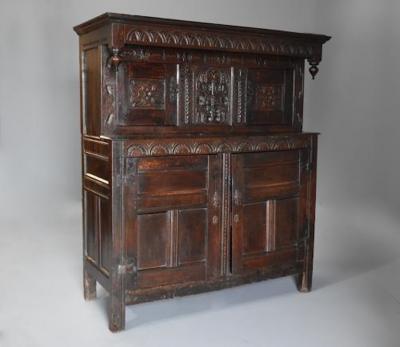Wonderful mid 17thc carved oak press cupboard with superb patina