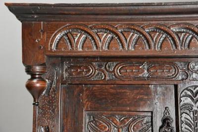 Wonderful mid 17thc carved oak press cupboard with superb patina