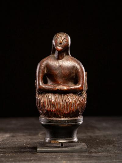 Wooden folk art figure depicting a stylized feminine soul burning in Purgatory