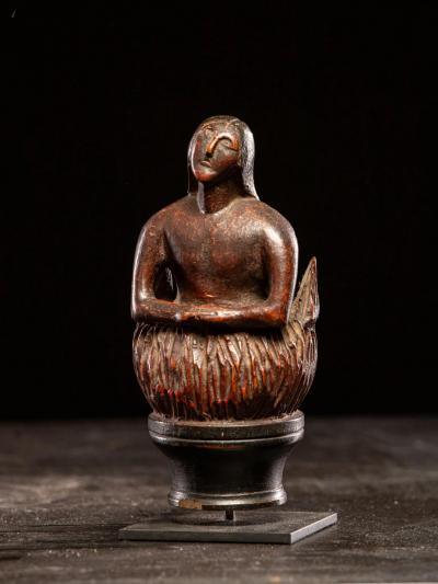 Wooden folk art figure depicting a stylized feminine soul burning in Purgatory
