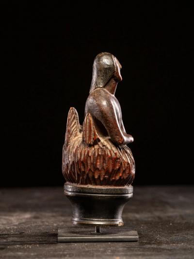 Wooden folk art figure depicting a stylized feminine soul burning in Purgatory
