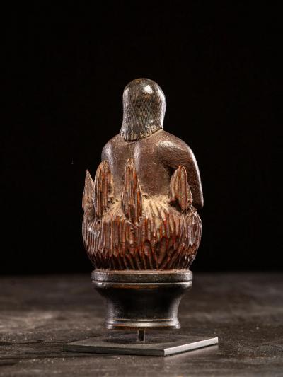 Wooden folk art figure depicting a stylized feminine soul burning in Purgatory