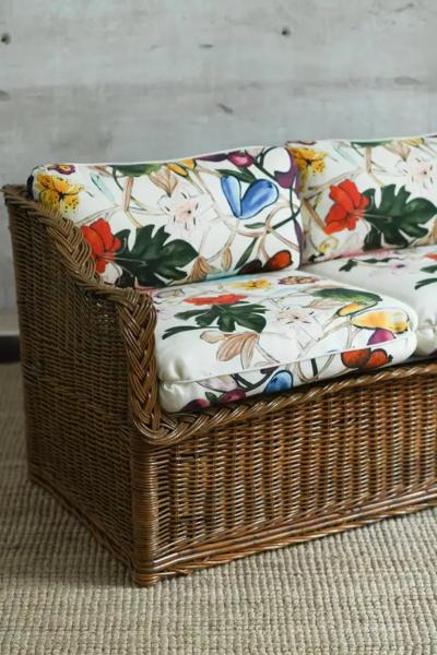 Woven rattan sofa with dedar fabric cushions