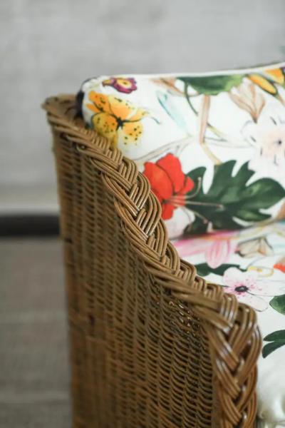 Woven rattan sofa with dedar fabric cushions