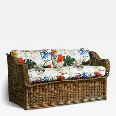 Woven rattan sofa with dedar fabric cushions