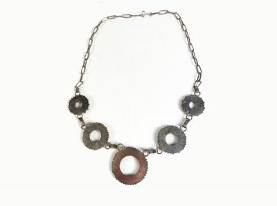 Zuni necklace with graduated circles done in needlepoint technique