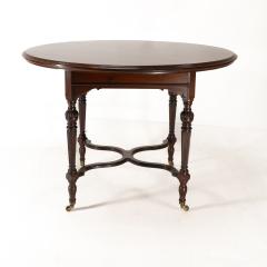  Collinson Lock Collinson Lock attributed An Aesthetic Movement walnut circular center table - 4191616