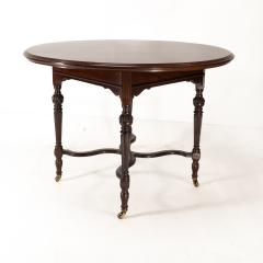  Collinson Lock Collinson Lock attributed An Aesthetic Movement walnut circular center table - 4191617