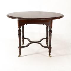  Collinson Lock Collinson Lock attributed An Aesthetic Movement walnut circular center table - 4191618