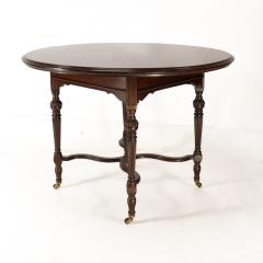  Collinson Lock Collinson Lock attributed An Aesthetic Movement walnut circular center table - 4191619