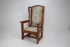  E G Punnett E G Punnet attributed Probably made by William Birch An oak wing back armchair - 4191652