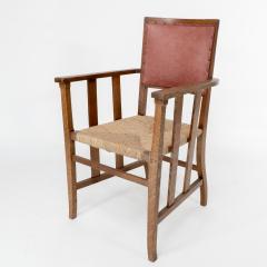  Liberty Co Liberty Co An Arts Crafts Rush Seat Armchair with a Shaped Back - 4185553
