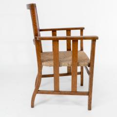  Liberty Co Liberty Co An Arts Crafts Rush Seat Armchair with a Shaped Back - 4185554
