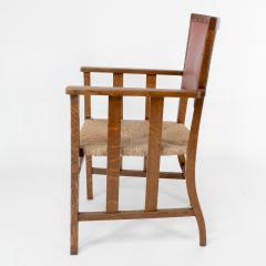  Liberty Co Liberty Co An Arts Crafts Rush Seat Armchair with a Shaped Back - 4185555