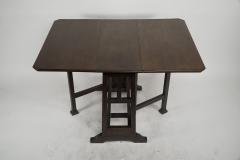  Liberty Co Liberty Co attributed A Good Quality Arts Crafts Oak Drop leaf Table - 4191969