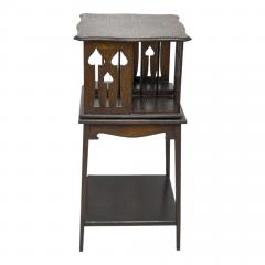  Liberty Co Liberty and Co An oak revolving bookcase with stylized floral cut out decoration - 4185652