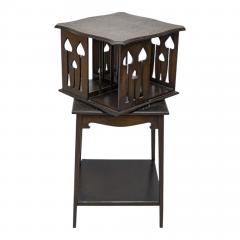  Liberty Co Liberty and Co An oak revolving bookcase with stylized floral cut out decoration - 4185653