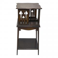  Liberty Co Liberty and Co An oak revolving bookcase with stylized floral cut out decoration - 4185654