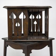  Liberty Co Liberty and Co An oak revolving bookcase with stylized floral cut out decoration - 4185656