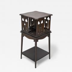  Liberty Co Liberty and Co An oak revolving bookcase with stylized floral cut out decoration - 4234474