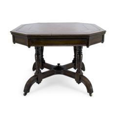  MAPLE Co Maple Co a Gothic Revival Oak Leather Top Writing Table on Decorative Castors - 4185723