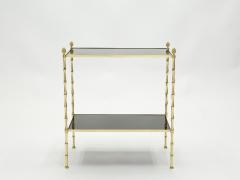  Maison Bagu s Pair of French Maison Bagu s bamboo brass black top two tier end tables 1960s - 1837067