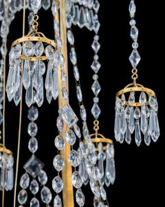  Werner Mieth A GERMAN NEOCLASSICAL SILVER AND GILT BRONZE TWELVE LIGHT CRYSTAL CHANDELIER - 3788066