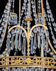  Werner Mieth A GERMAN NEOCLASSICAL SILVER AND GILT BRONZE TWELVE LIGHT CRYSTAL CHANDELIER - 3788092