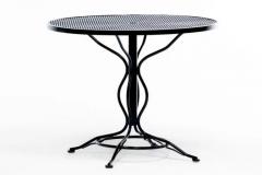  Woodard Furniture Co Mid Century Modern Black Wrought Iron Table with Sculptural Base and Footrests - 4098047