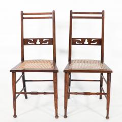  Wylie Lochhead A Pair of Arts Crafts Side Chairs with Stylized Tulip Cut outs to the Back - 4191500