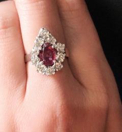 14 Karat White Gold Fashion Oval Ruby Solitaire Ring with Encircling Diamonds - 2831683