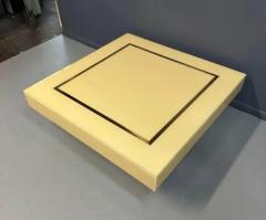 1970s Acrylic Stepped Cream Colored Coffee Table with Brass Ribbon Inlay - 3245064