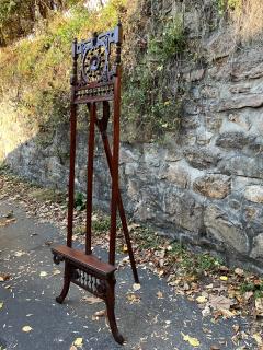 19TH CENTURY CARVED WOOD PAINTING EASEL WITH OWL CREST