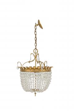 2 French chandeliers with a brass top supporting multiple crystals strands - 4162241