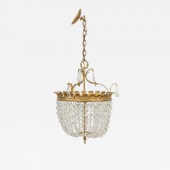 2 French chandeliers with a brass top supporting multiple crystals strands - 4167623