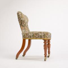 A 19th Century Irish mahogany upholstered chair with brass casters - 1646967