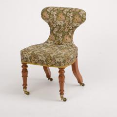 A 19th Century Irish mahogany upholstered chair with brass casters - 1646970