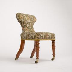 A 19th Century Irish mahogany upholstered chair with brass casters - 1646971