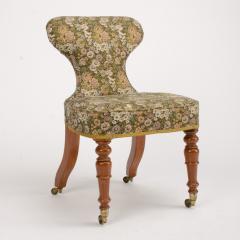 A 19th Century Irish mahogany upholstered chair with brass casters - 1646985