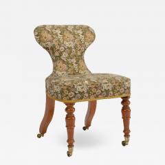 A 19th Century Irish mahogany upholstered chair with brass casters - 1647967