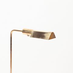 A Brass and glass adjustable floor lamp C 1970  - 2536164