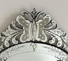 A Custom Venetian Style Circular Mirror with Ornate Butterfly and Floral Crest - 3470036