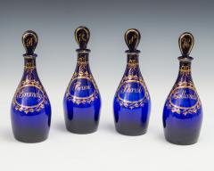 A FINE SET OF FOUR BRISTOL BLUE GILT LABEL ANTIQUE GEORGIAN DECANTERS - 3791099