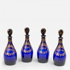 A FINE SET OF FOUR BRISTOL BLUE GILT LABEL ANTIQUE GEORGIAN DECANTERS - 3796599