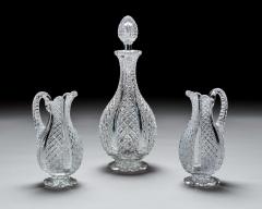 A FINELY CROSSOVER DIAMOND CUT DECANTER WITH MATCHING PAIR OF JUGS - 4290297