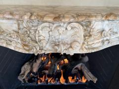 A Finely Carved Louis XV Style Fireplace Mantel in Figured Italian Marbl - 4587389