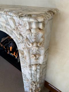 A Finely Carved Louis XV Style Fireplace Mantel in Figured Italian Marbl - 4587390