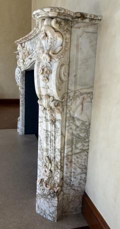 A Finely Carved Louis XV Style Fireplace Mantel in Figured Italian Marbl - 4587393